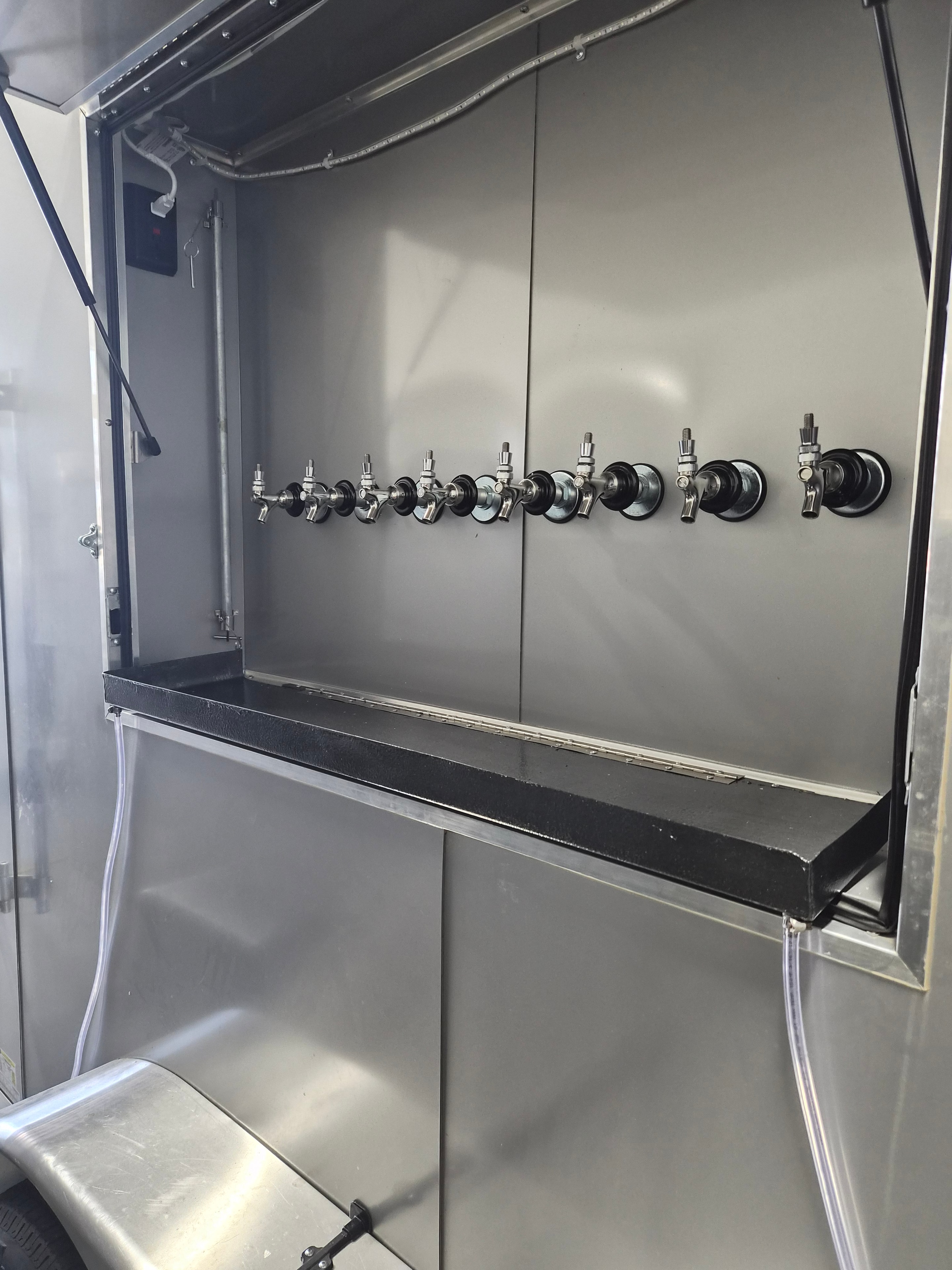 8 lines on each side with doors over the faucets that can be closed and locked for overnight use without untapping lines inside trailer.
